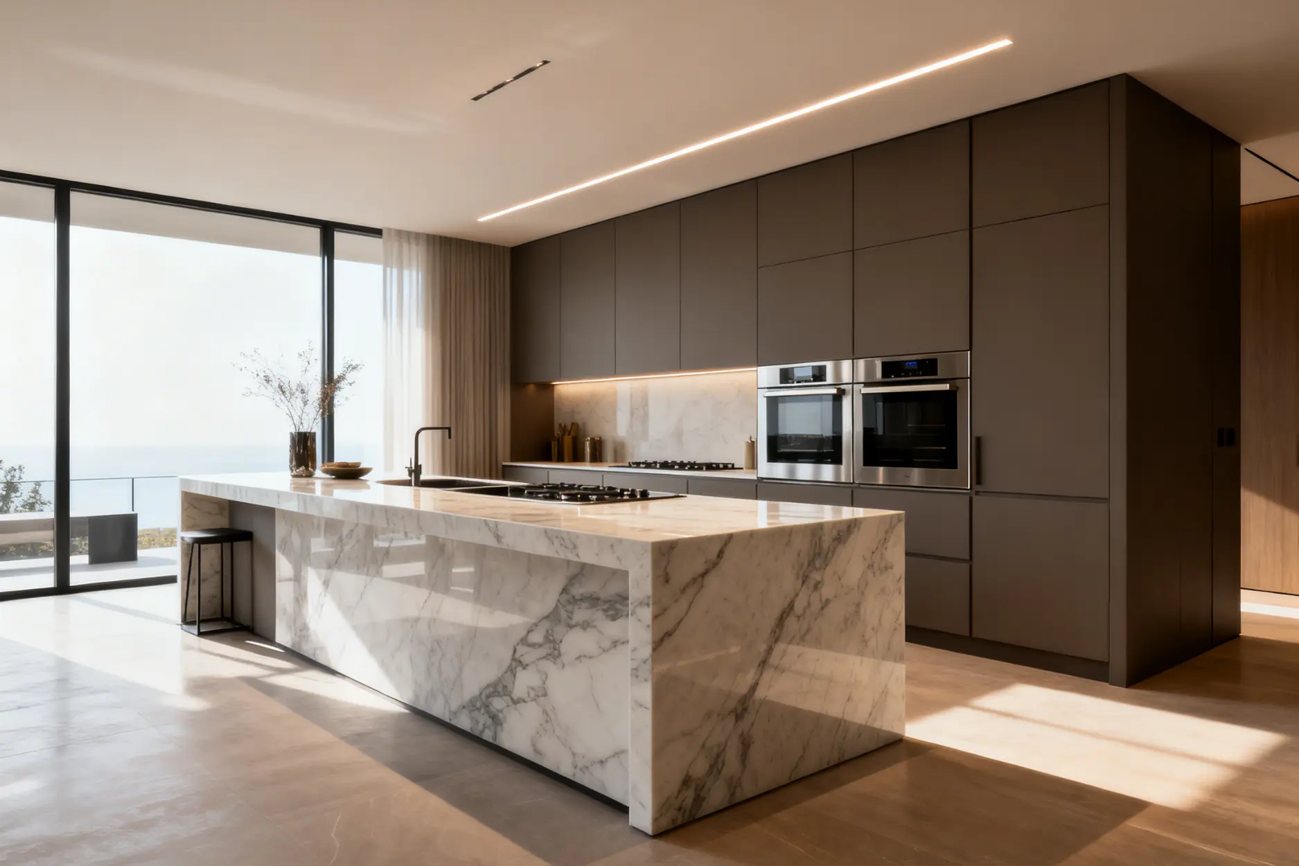 Modern luxury kitchen featuring a marble waterfall island and sleek brown minimalist cabinetry.