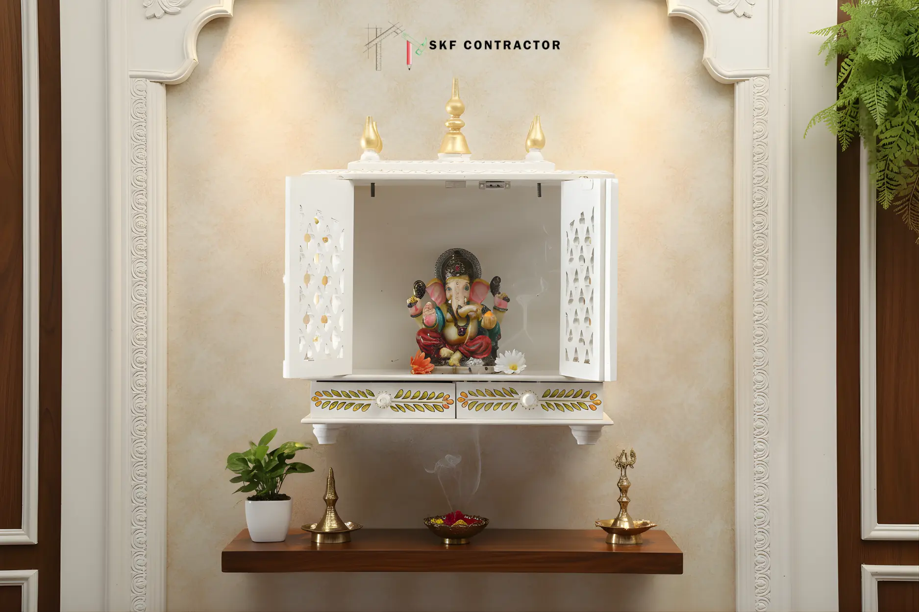 A small two-door wall-mounted puja unit