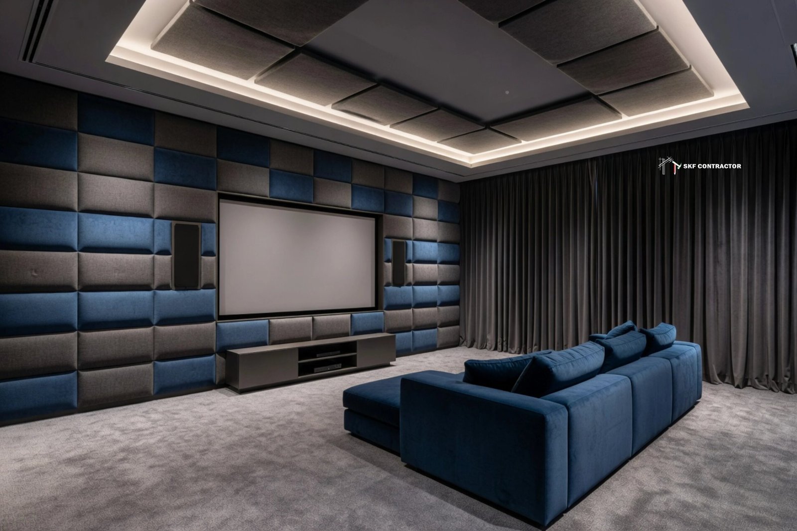 Modern home theater room featuring a blue velvet sofa, acoustic wall panels, and a large projection screen.
